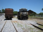 NS 7584 and sister sit i the old Carrollton yard tracks.  NS evidently runs a connection train from Rome to move cars in and out of the long truncated secondary line.  Power then lays over for the outbound train.